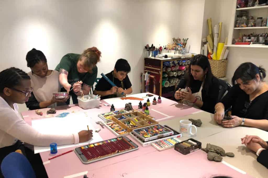 People taking part in art therapy session